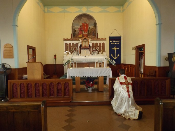 Father John Paul Gardner prepares for Mass at St. Clement's Catholic Church 